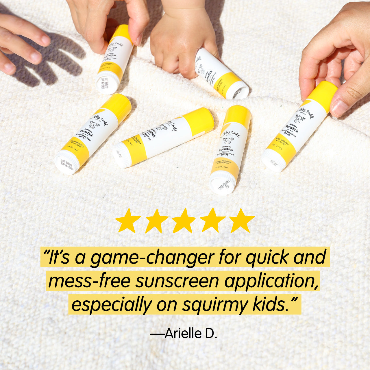 Hands applying yellow and white sunscreen tubes on a textured surface with five-star rating and review text.